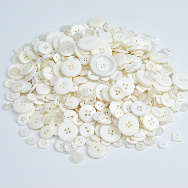 White resin craft buttons, round four-hole design, assorted sizes