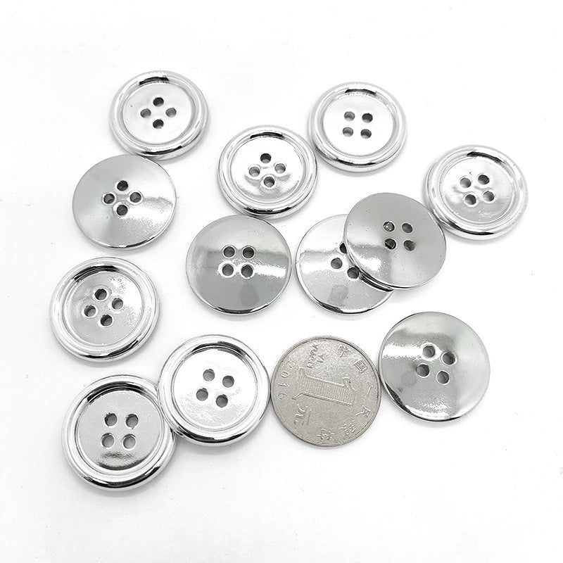 Assorted round 4-hole plastic buttons with silver edge and electroplated sheen