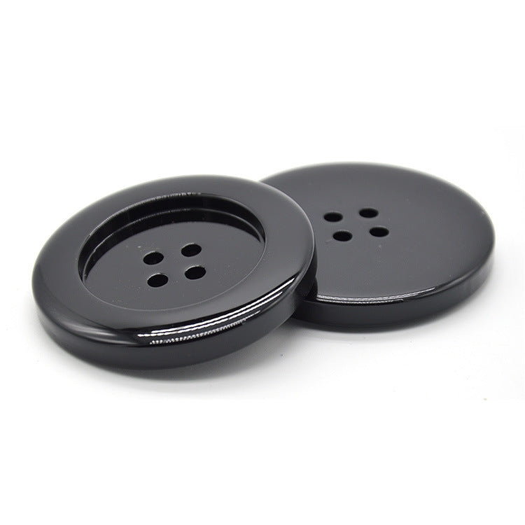 Glossy black resin round button with four holes, front view (6pcs)
