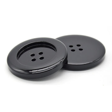 Glossy black resin round button with four holes, front view (6pcs)