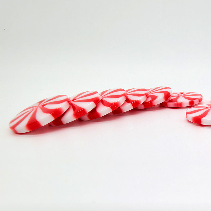 Row of red and white striped windmill candy round resin buttons, two-hole design