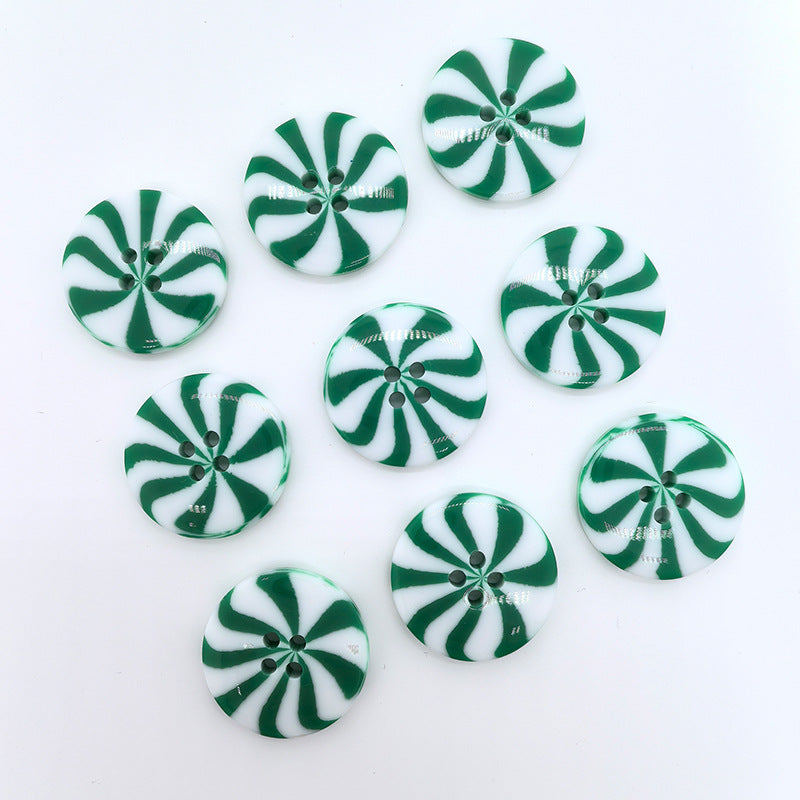 Round resin windmill buttons: green stripes on white, 1 inch, two-hole front view