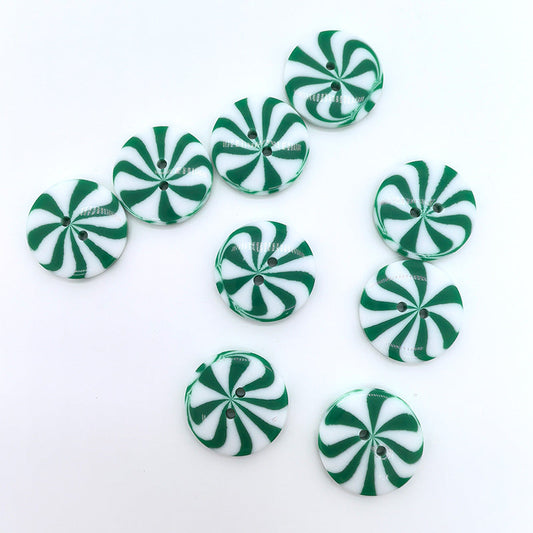 Front view of 1-inch green & white windmill resin buttons, two-hole, 40 pcs