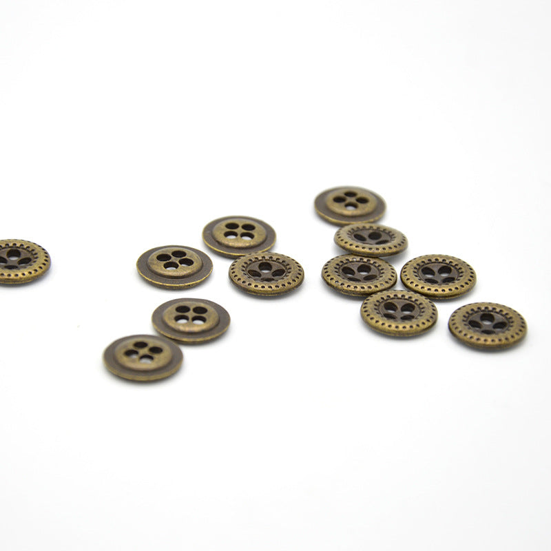 Antique bronze round 4-hole shirt buttons, small grouped arrangement