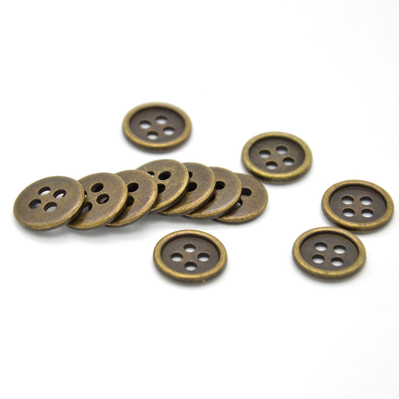 Antique bronze round 4-hole shirt buttons, side view showing thickness