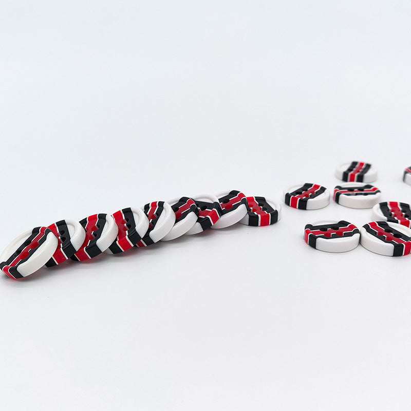 Row of red and black striped round resin shirt buttons, 4-hole design