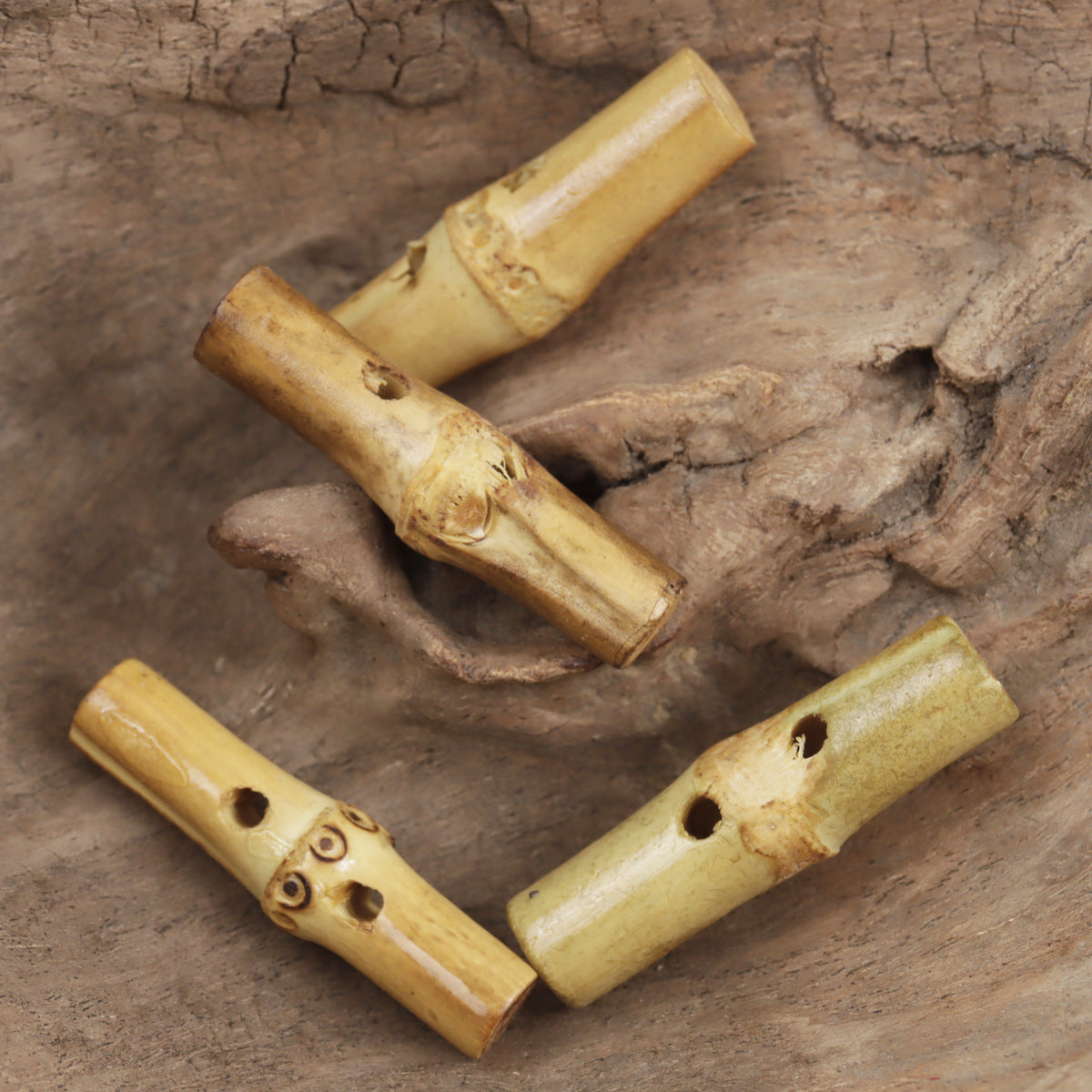 Irregular bamboo knot toggle buttons, curved cylindrical shapes with multiple round holes