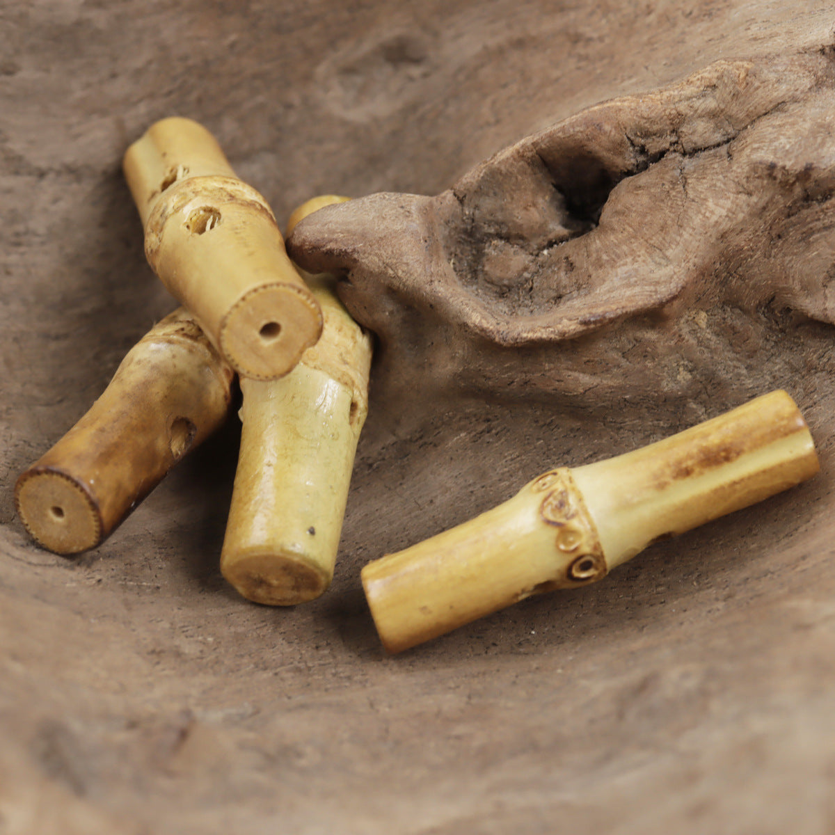 Irregular bamboo knot toggle buttons, cylindrical pieces with cut holes and dark knot accents