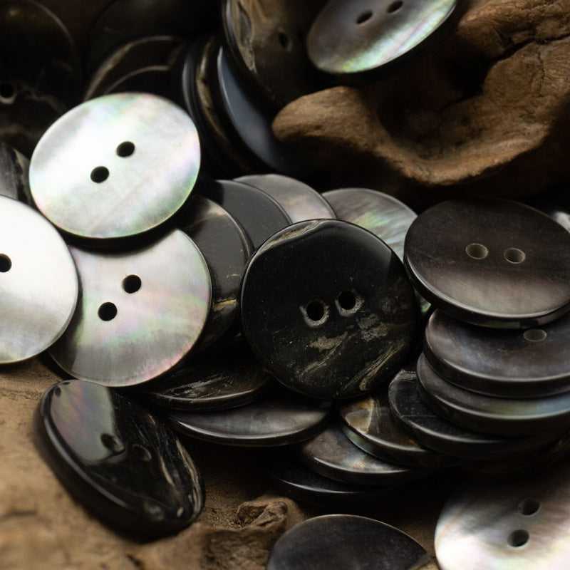 Assorted 2-hole flat shell buttons, black and iridescent gray, round, glossy