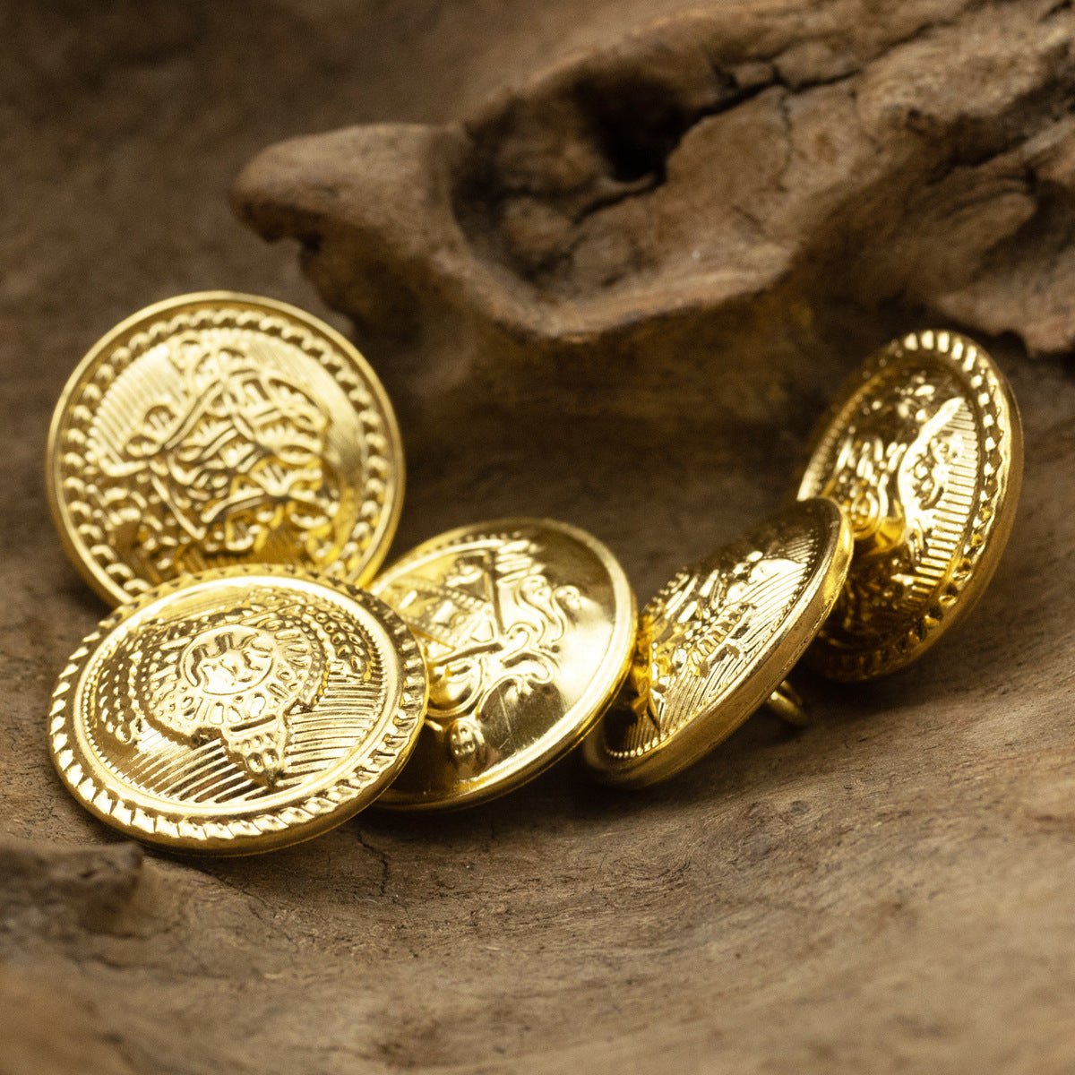 Gold metal shank buttons, front faces with wheat and shield emblems