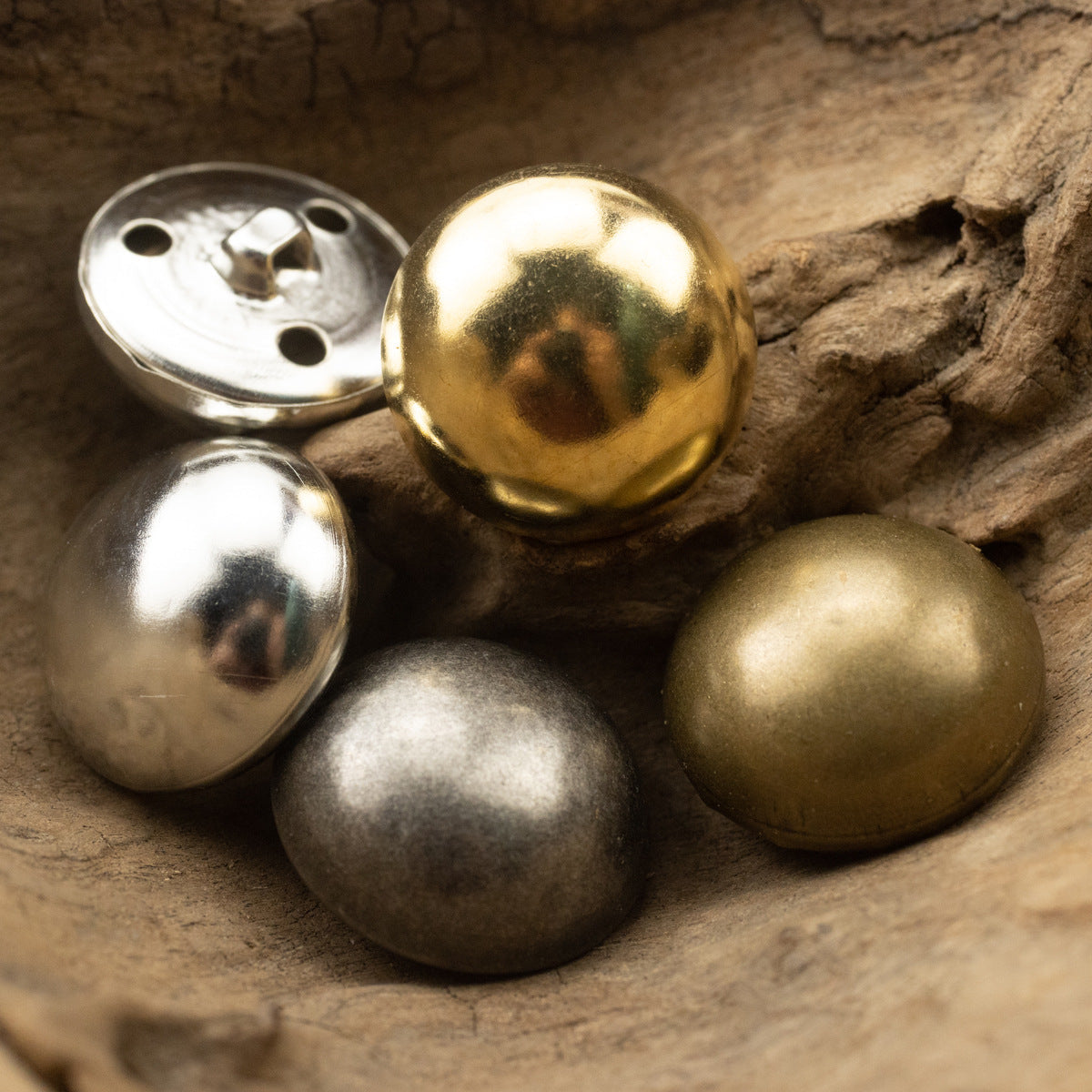 Mixed-finish mushroom shank buttons, round metal fronts with vintage shine