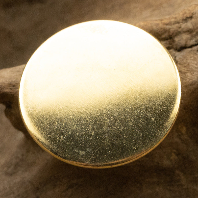 Round vintage metal button, gold tone finish with hollow shank holes