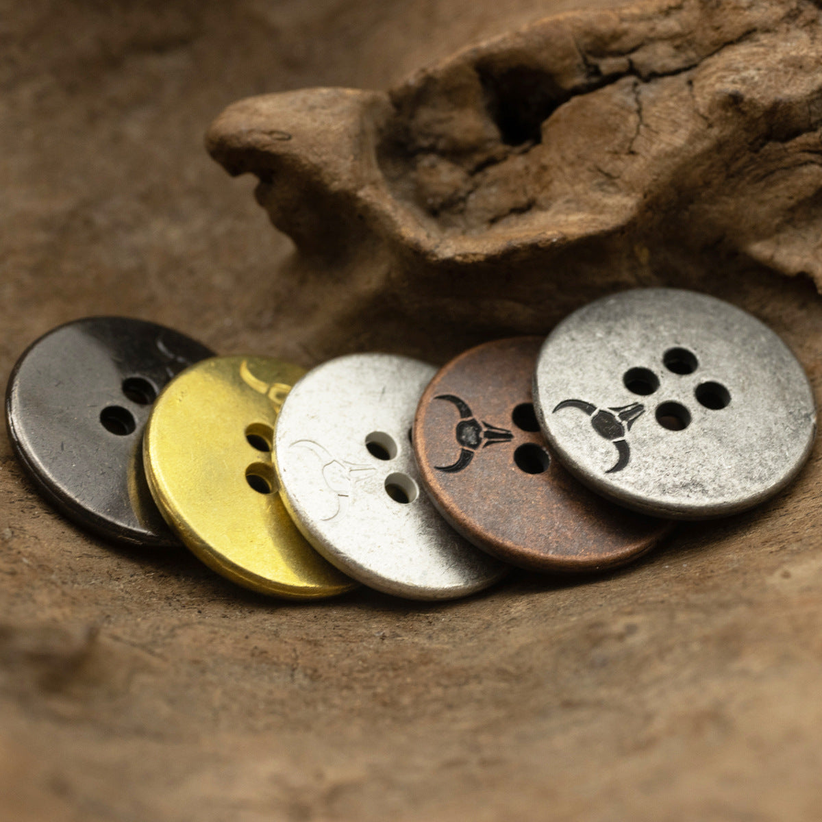 Round 4-hole metal buttons in mixed finishes: silver, gold, and dark bronze