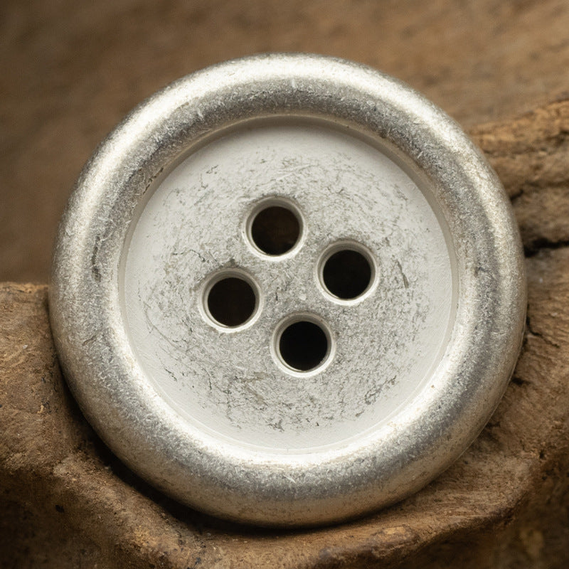 Round 4-hole metal button with matte silver finish and four holes