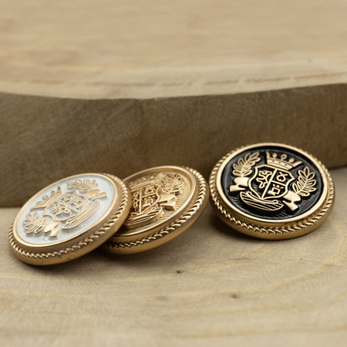 Suit buttons with crown-and-wheat crest, white gold, gold, and black gold colorways