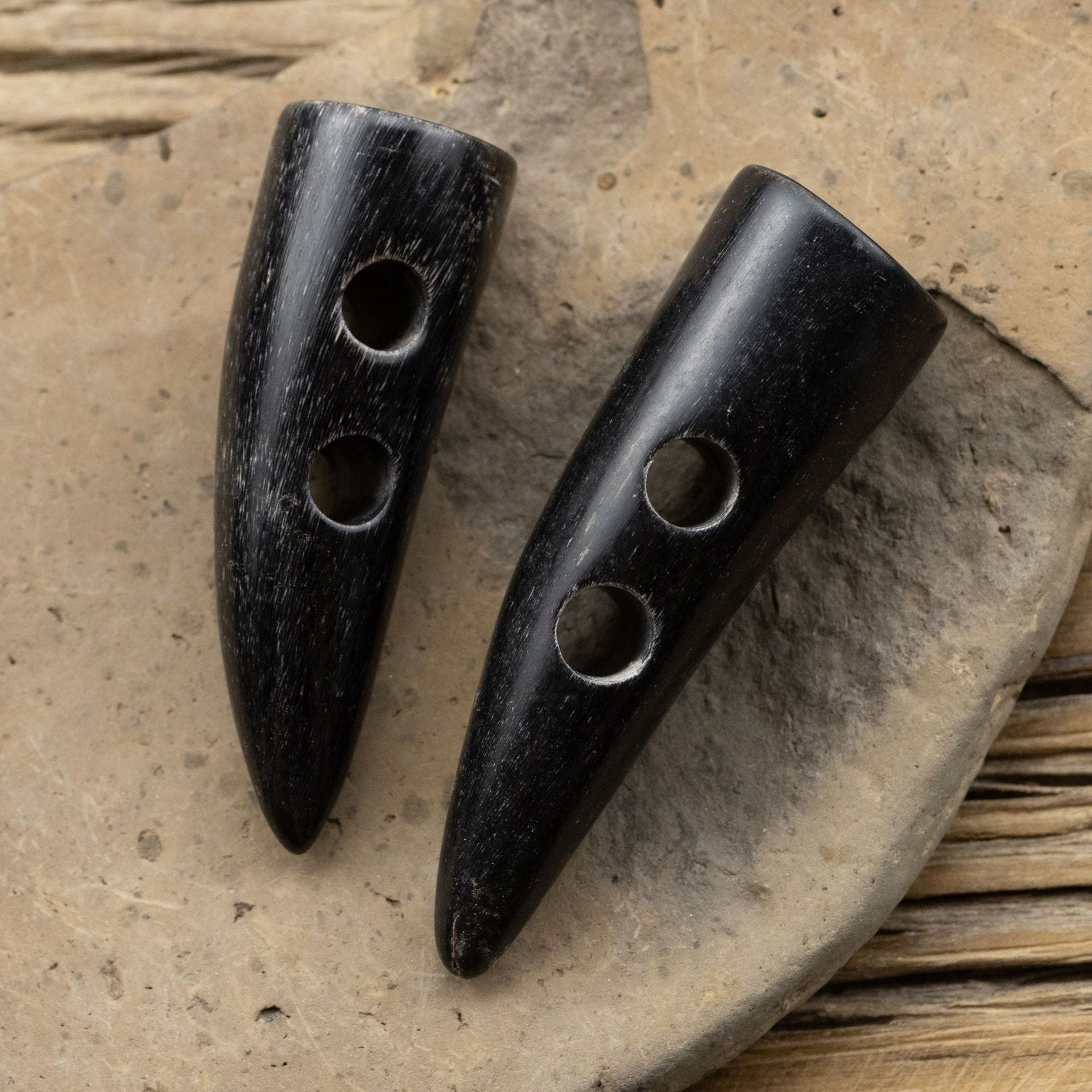 Black natural real horn toggle buttons, 5pcs—front view with circular shank holes
