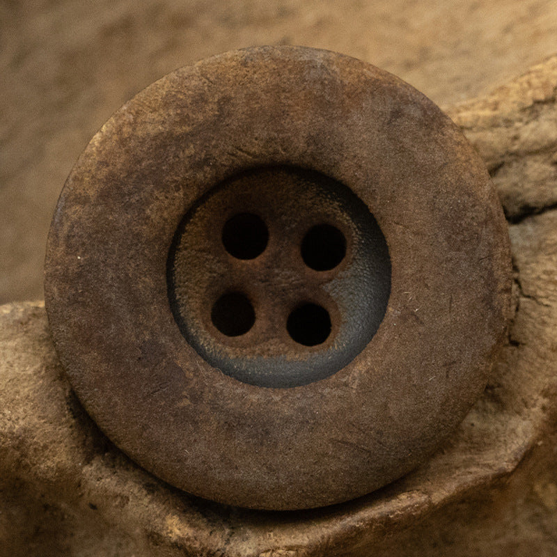 Antiqued horn button, large 4-hole front with matte, weathered surface