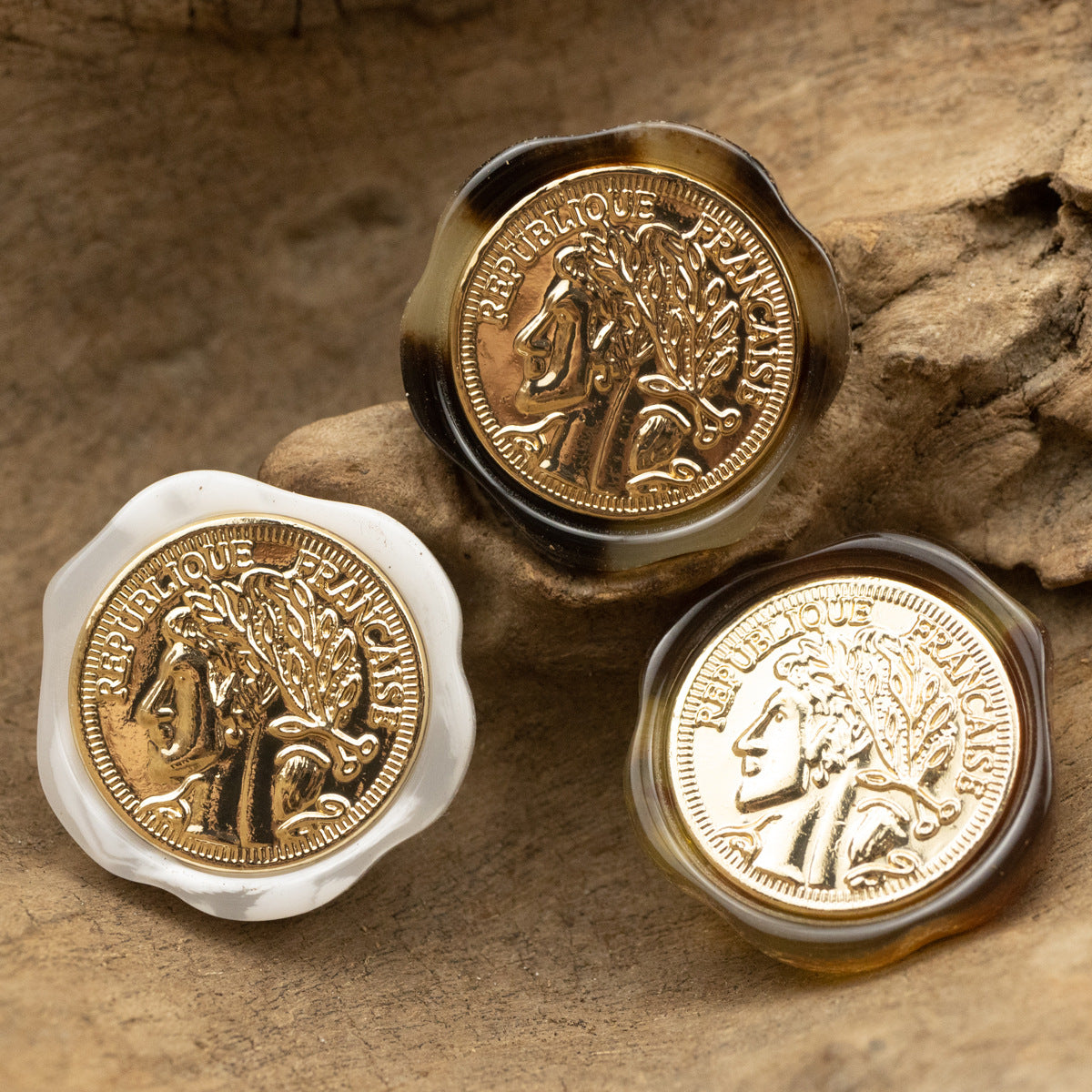 Irregular resin shank button set, mixed tones—white and dark brown/black with gold portrait