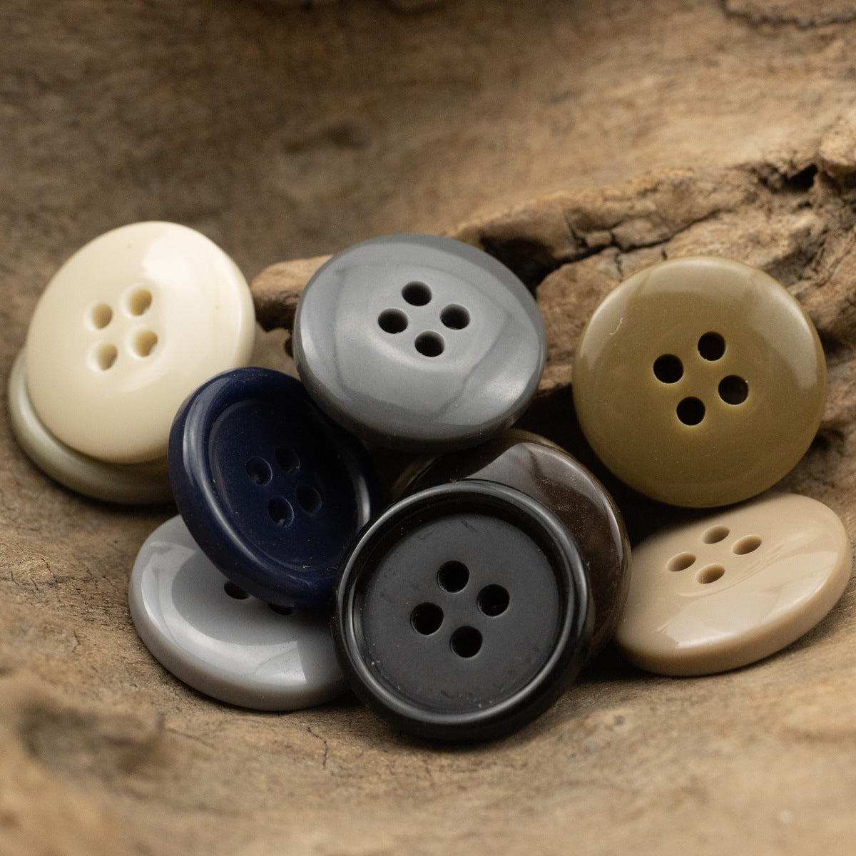 Assorted solid color resin suit buttons, 4-hole design on a close set