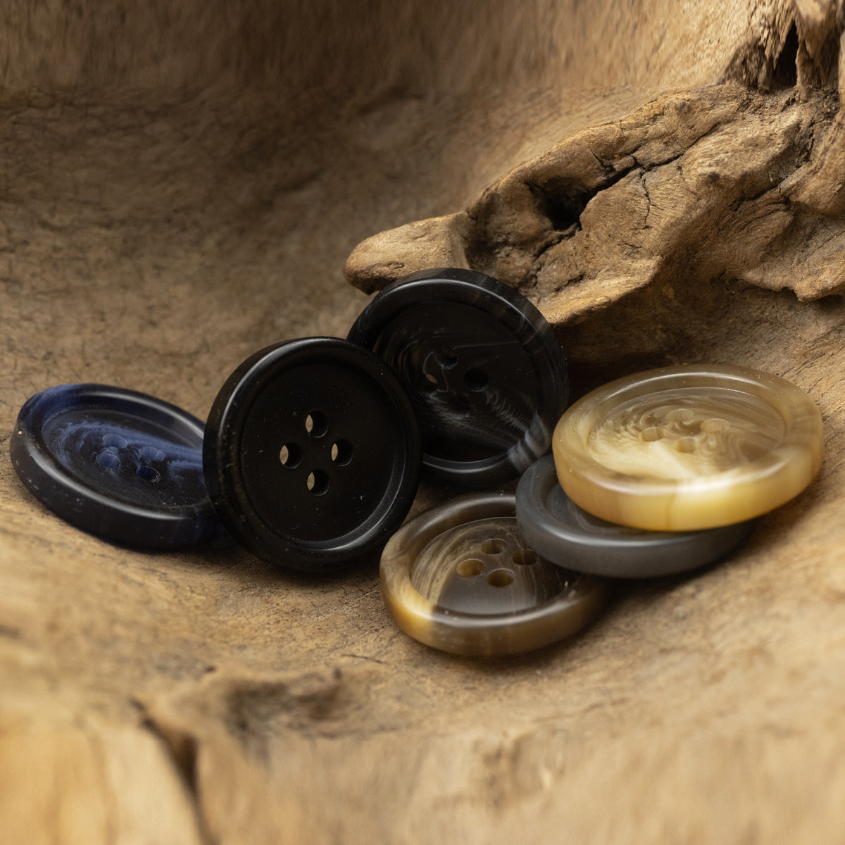 Round resin buttons set: dark navy, black, and khaki-beige four-hole design