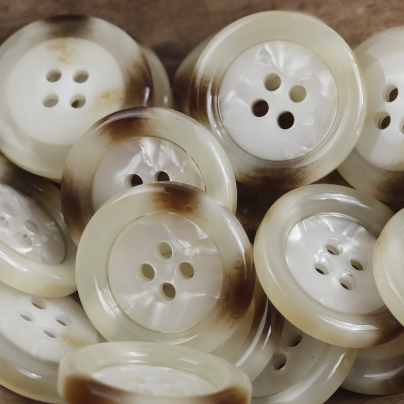 Round 4-hole imitation shell buttons in white and amber tones, multiple pieces
