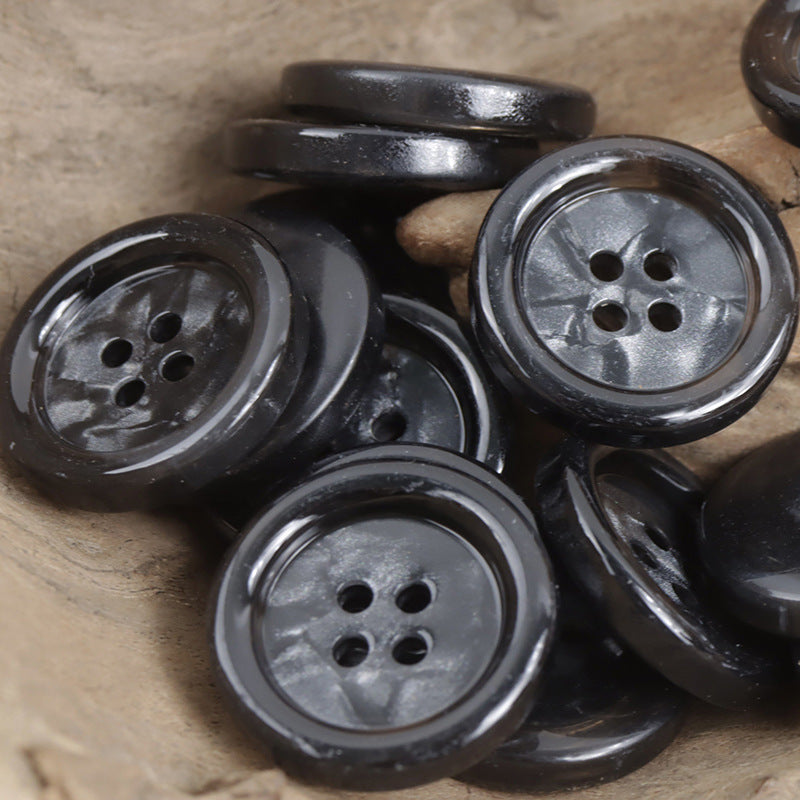 Round 4-hole imitation shell buttons in dark gray/black, multiple pieces