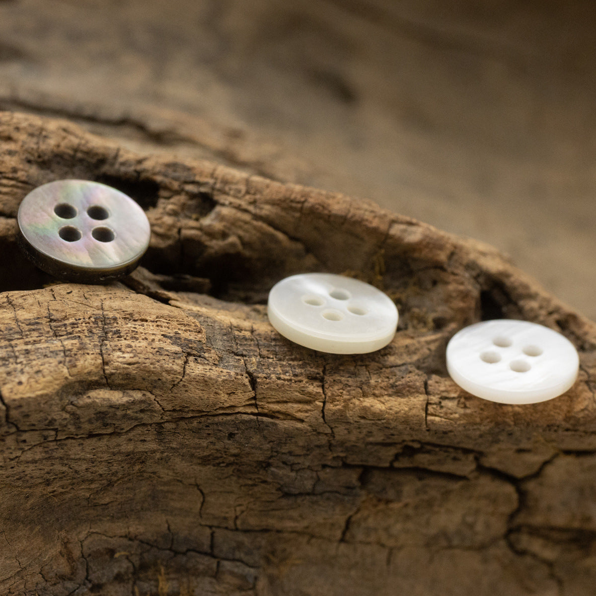 Natural pearl shell buttons, double flat, four-hole, white and soft iridescent tones