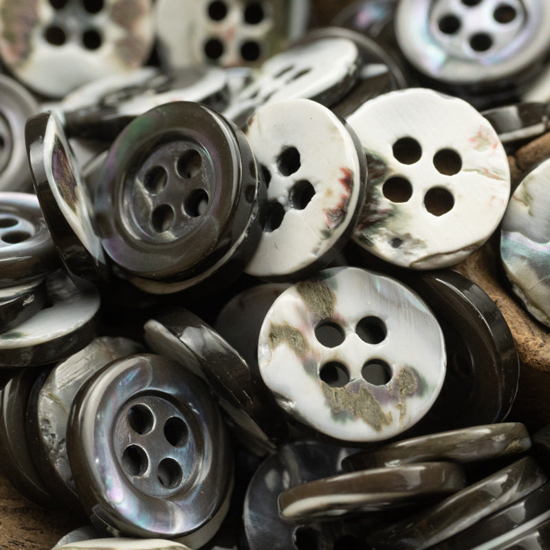 Mixed dark iridescent and white shell buttons, round 4-hole, assorted pieces.