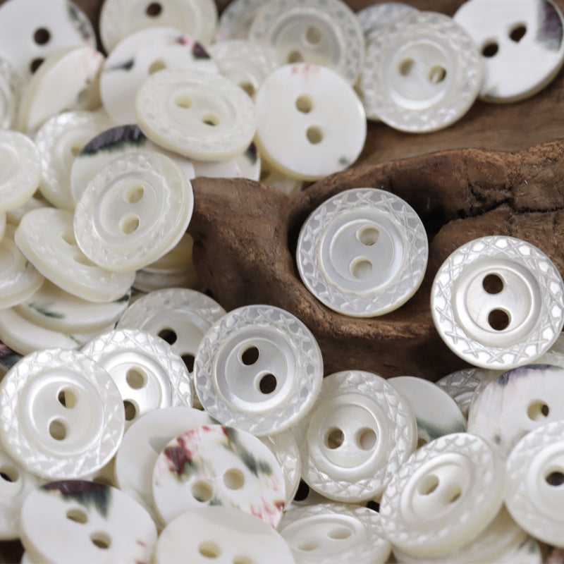 Natural mother-of-pearl button mix, mostly white, round with 2-hole centers
