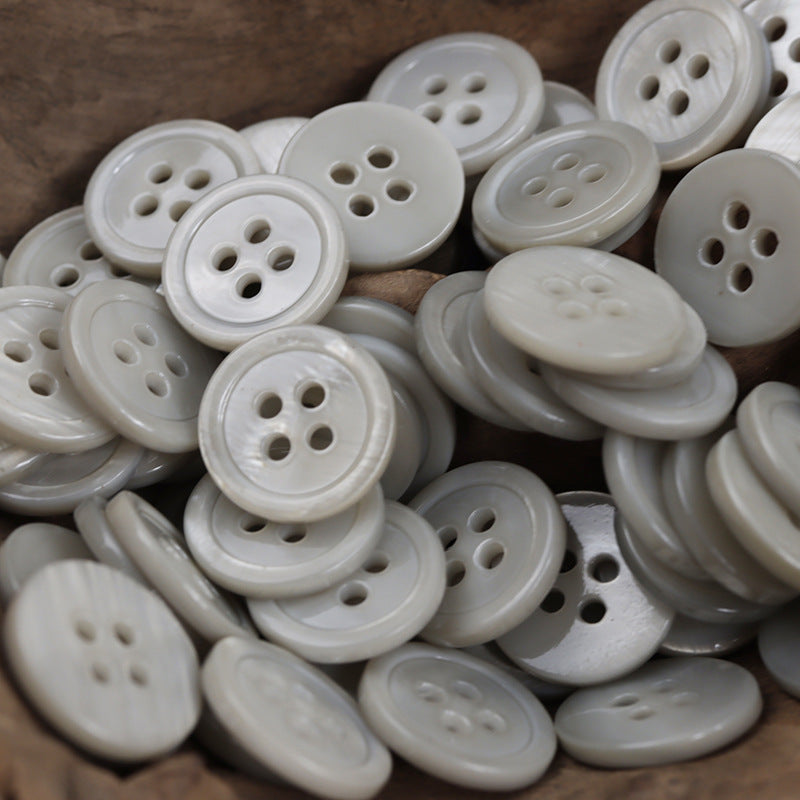15mm natural shell-look buttons, 4-hole, light gray—pile of multiple round buttons