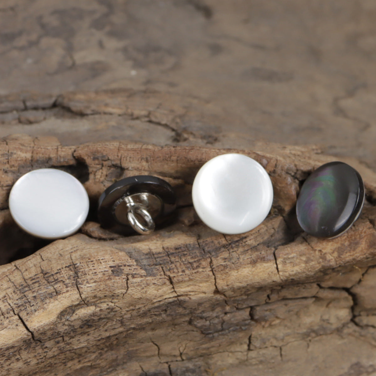 11.5mm natural shell shirt buttons: two white and two dark iridescent faces