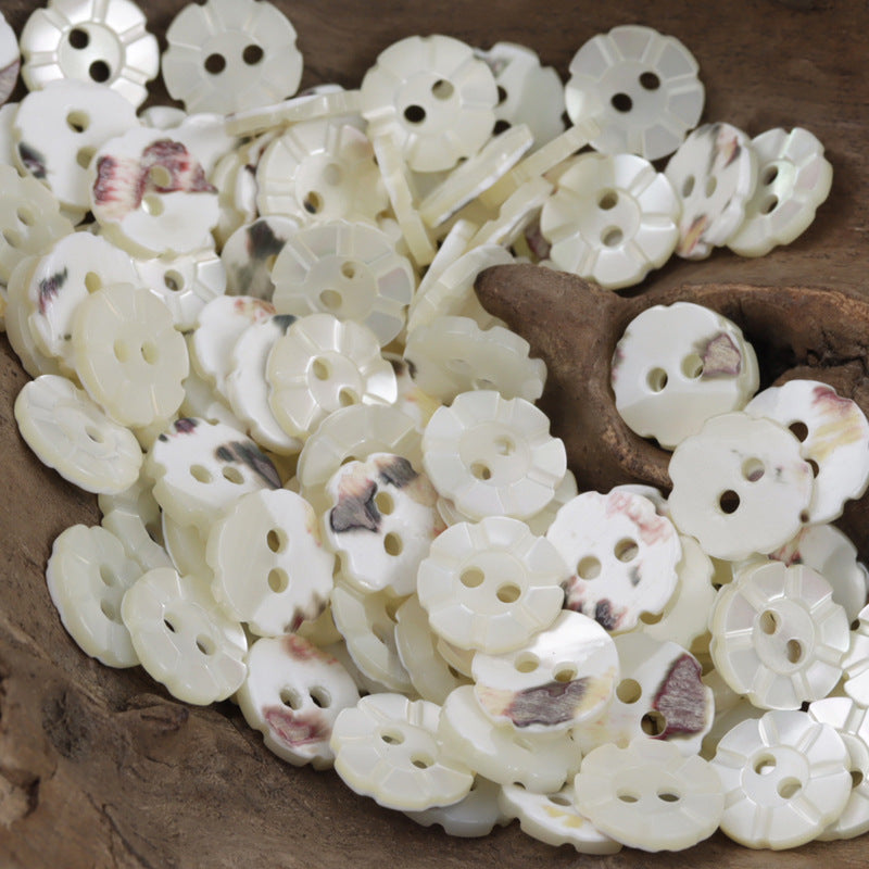 Mixed natural off-white two-hole shell buttons, laser-engraved detail