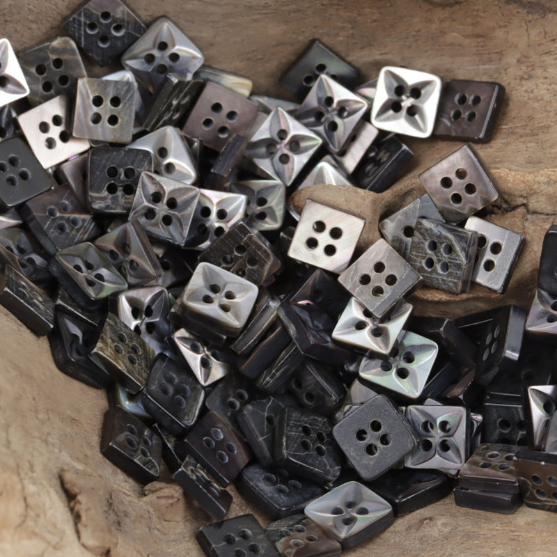 Irregular rhombus shell buttons assortment, glossy black and white tones, 2-hole/4-hole
