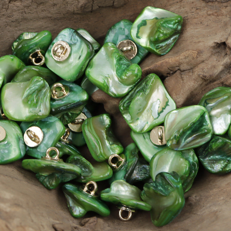 Green shell shank buttons, square shape, with gold-toned metal loops