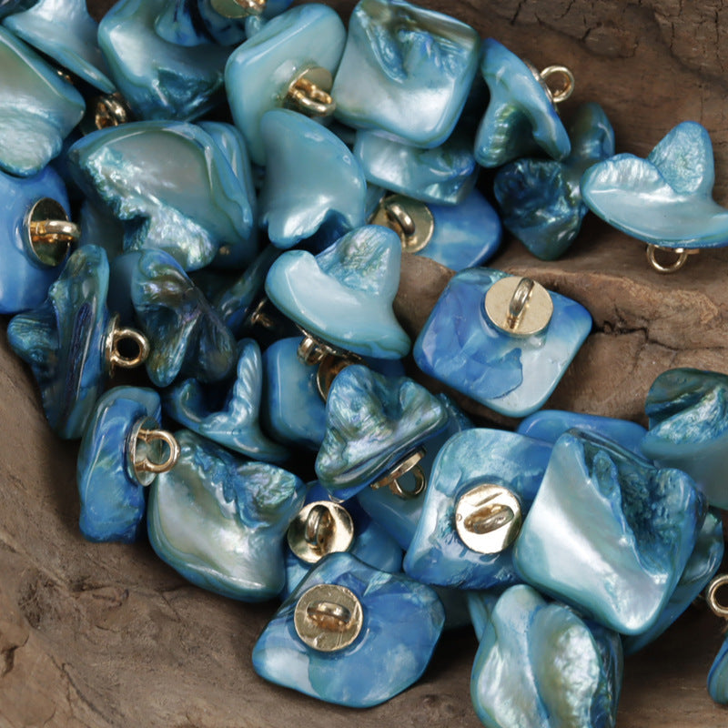 Blue shell shank buttons, square shape, with gold-toned metal loops
