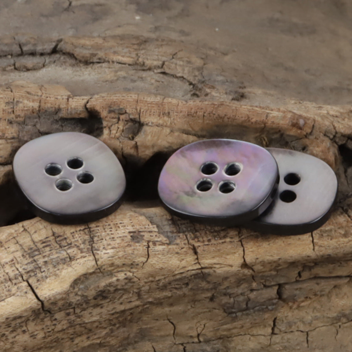 Set of pearl shell buttons: black and iridescent shades with 4 holes each