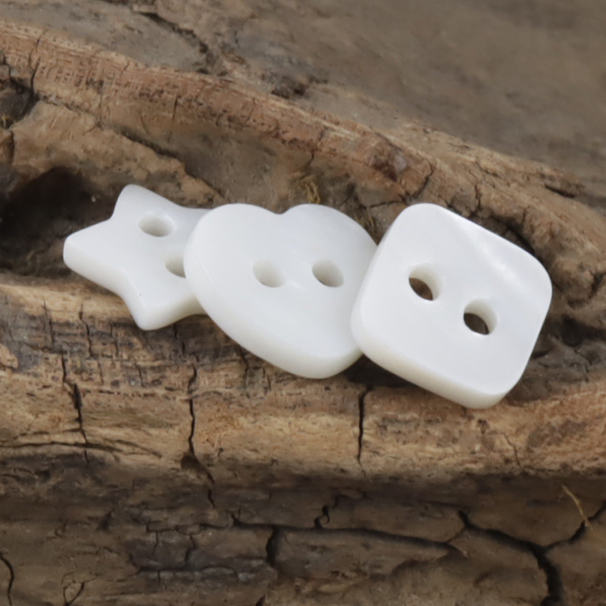 Natural shell child buttons: star, heart and square shapes, white, two holes