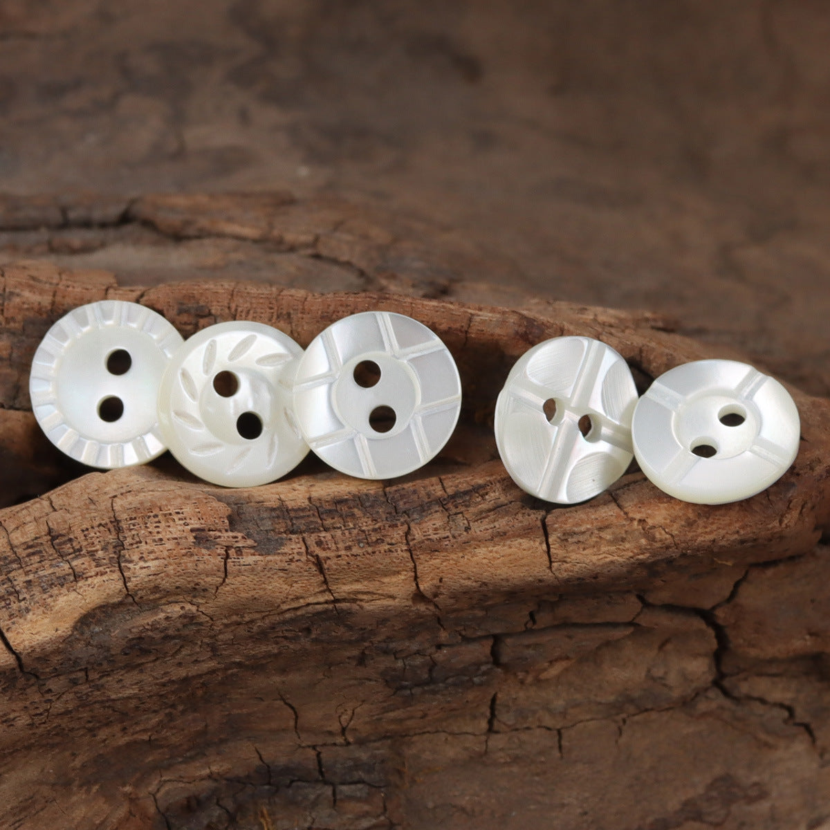 11.5mm white natural shell buttons, round 2-hole, ridged spoke and cross textures