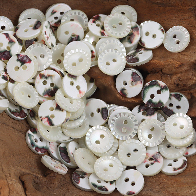 Natural shell buttons set: white round 2-hole with floral mottled border and raised ridges