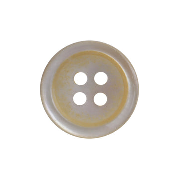 Irregular light beige shell button, four holes, single close-up