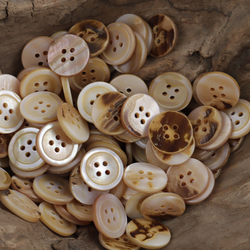 Assorted light beige shell buttons, irregular tones, multiple four-hole styles