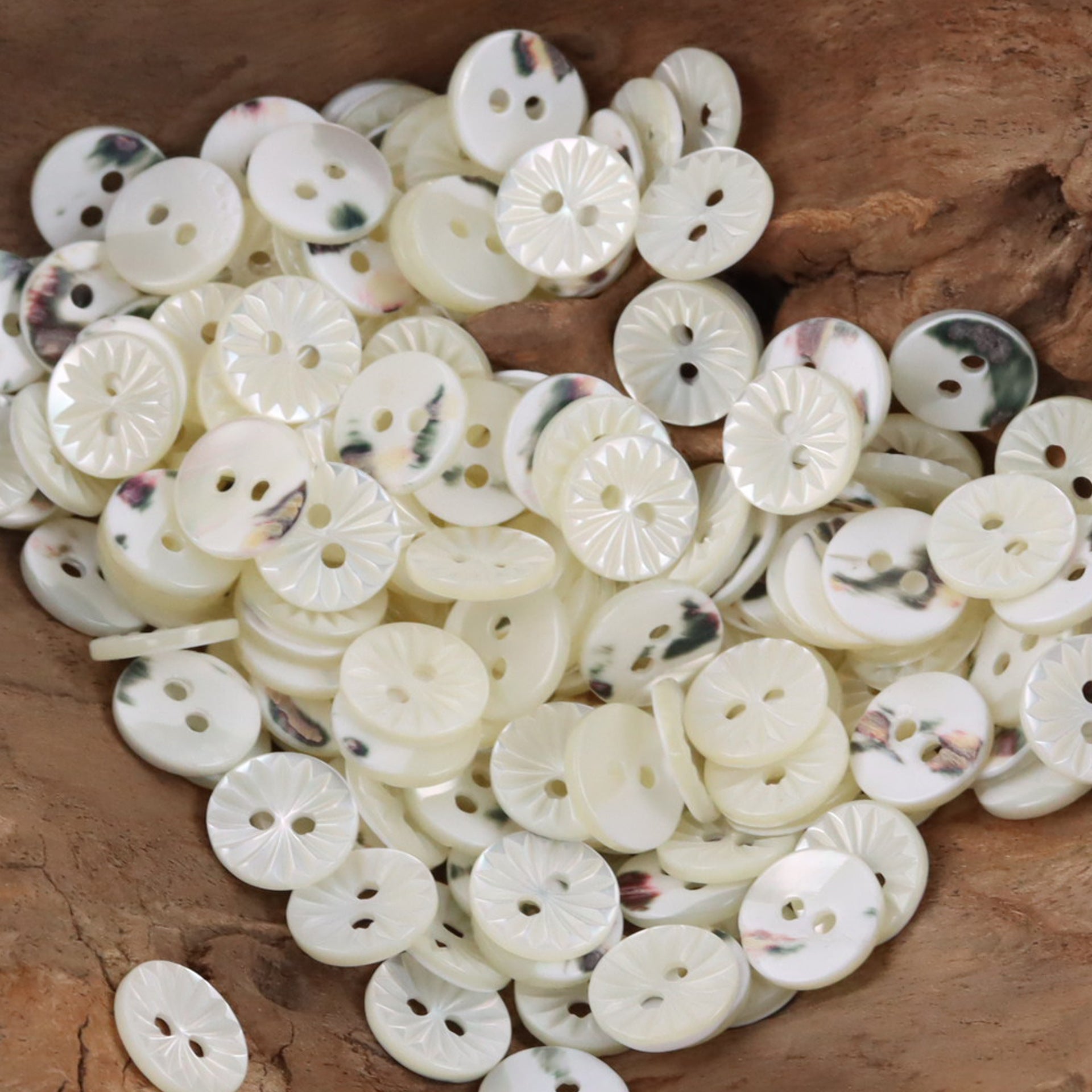 Bulk mix of cream-white shell-look shirt buttons, multihole button fronts