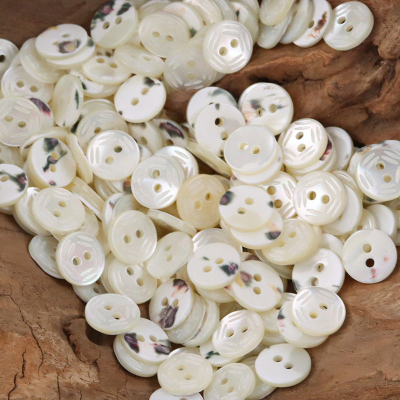 Assorted cream-white shell-look shirt buttons with multihole faces