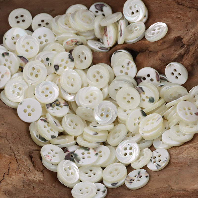 Large mix of cream-white natural shell shirt buttons, multihole faces
