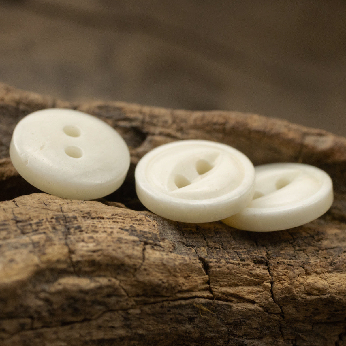 Ivory two-hole bone buttons, multiple round fronts with recessed sewing holes