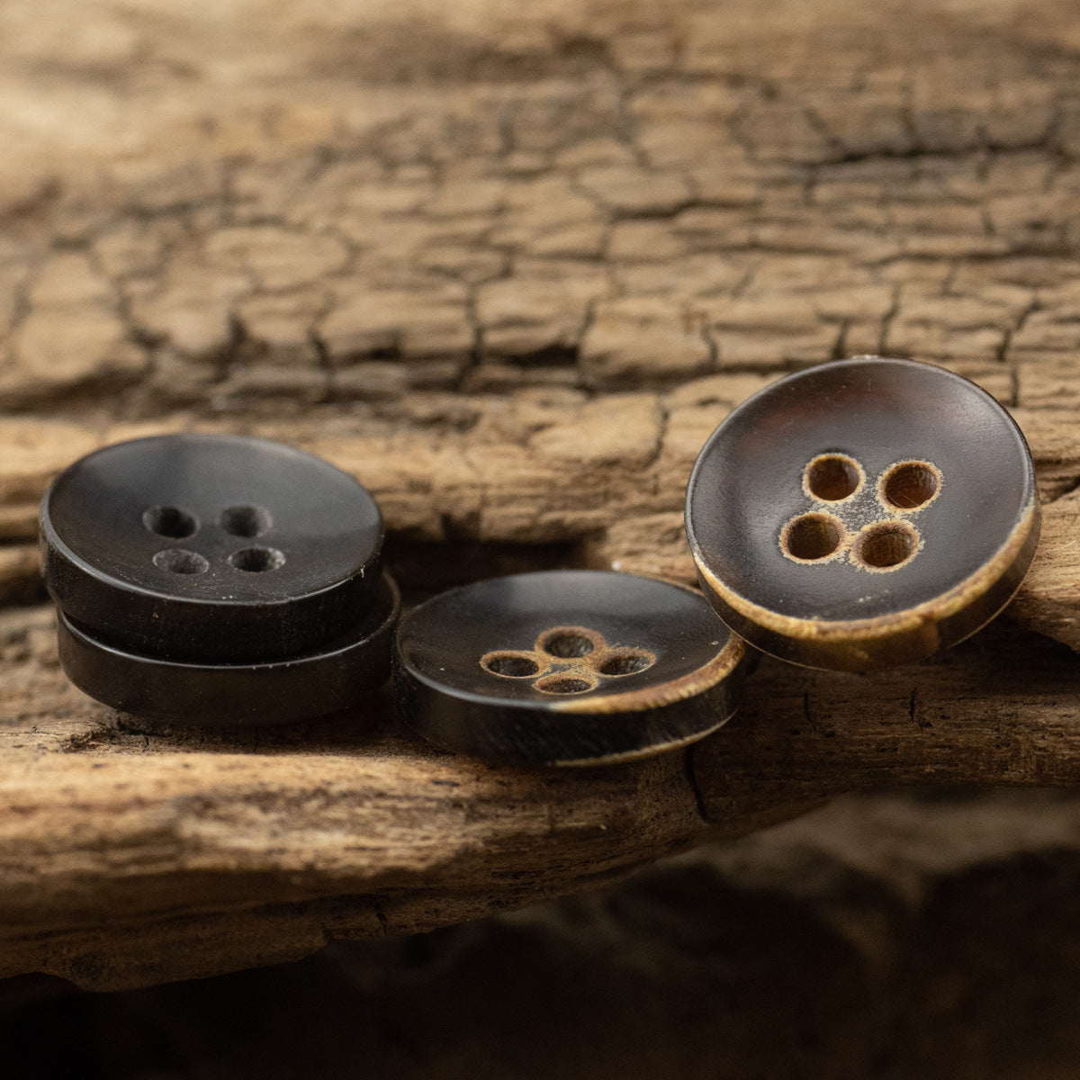 Black and brown 4-hole bowl shirt buttons, front view, 10 pcs