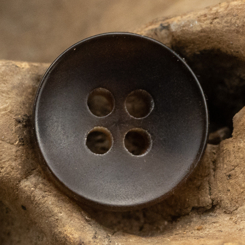 Black 4-hole bowl shirt button, close-up front, 10 pcs