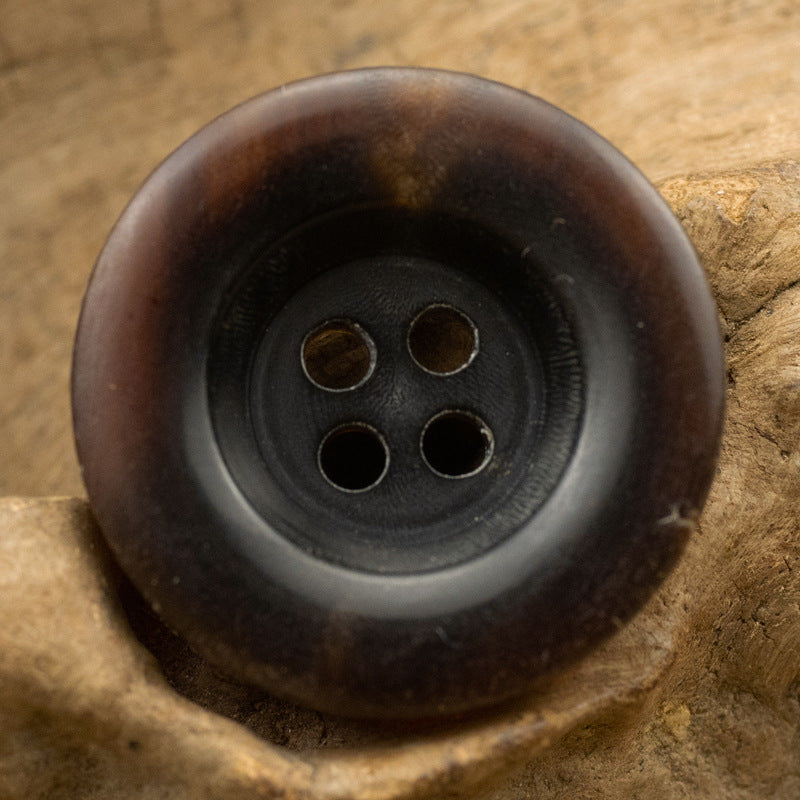 Thickened horn button, 4-hole, coffee-brown top close-up