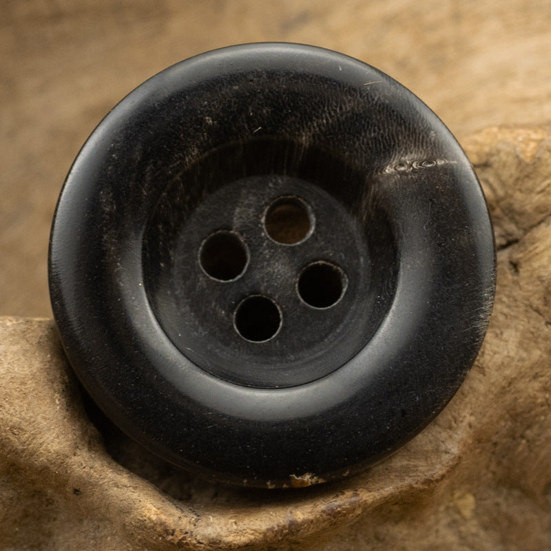 Thickened horn button, 4-hole, black close-up