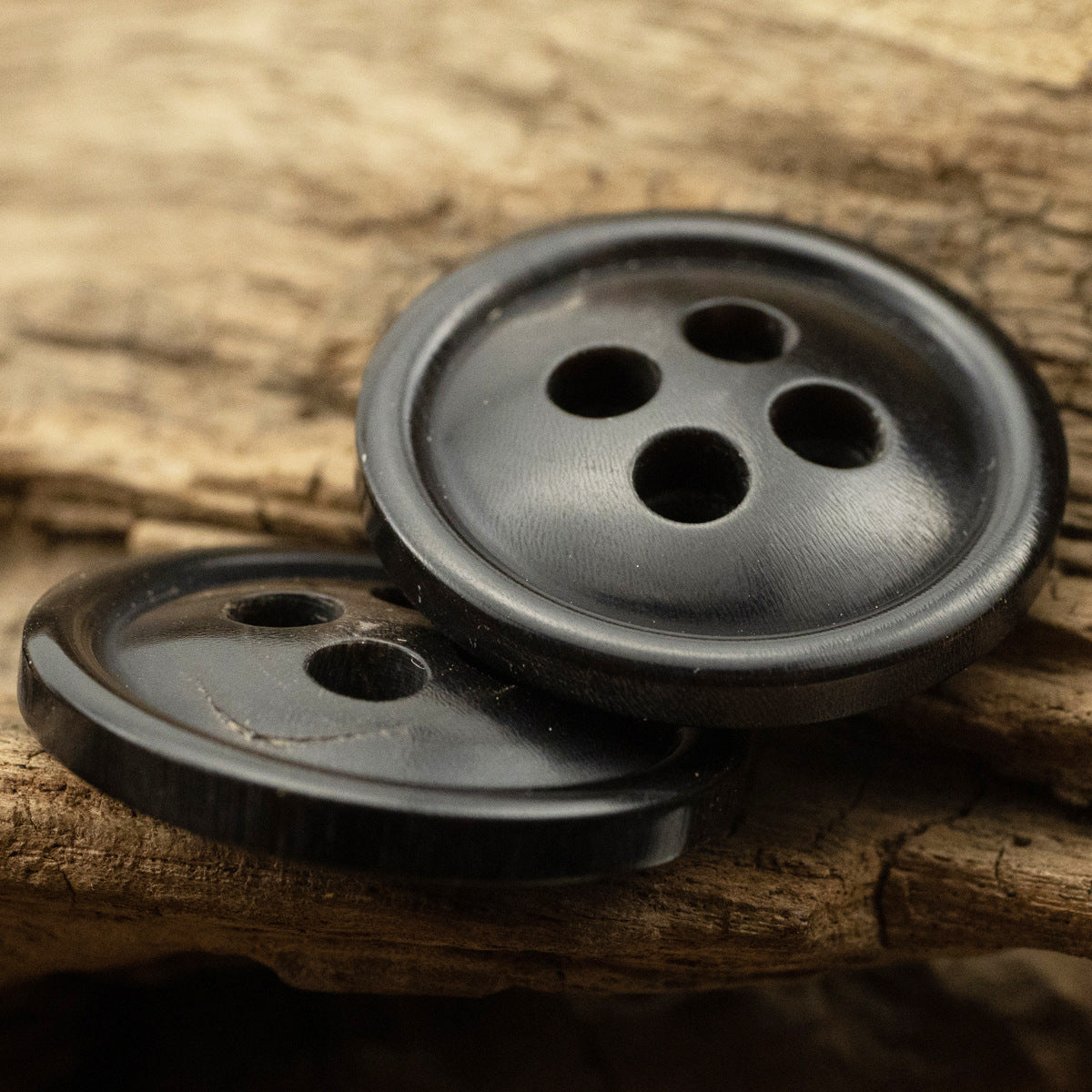Black horn coat buttons, two round 4-hole buttons with glossy rim